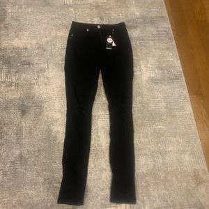 Women’s fitted black jeans, distressed at the knees, size 4